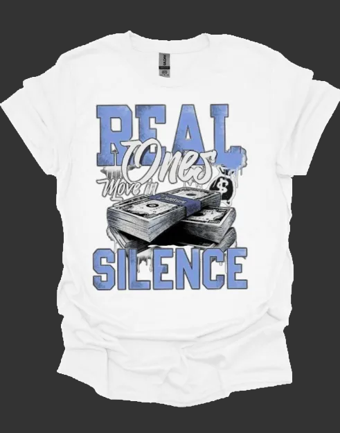 White t-shirt with graphic design and text 'Real Ones Move in Silence' on a white background