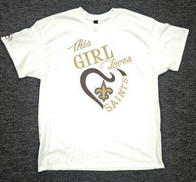 White t-shirt with gold and black text and graphics on a dark gray background