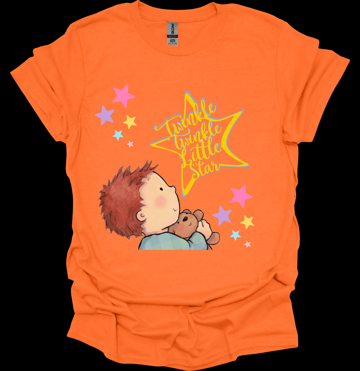 Orange t-shirt with a child holding a teddy bear and a star graphic on a black background