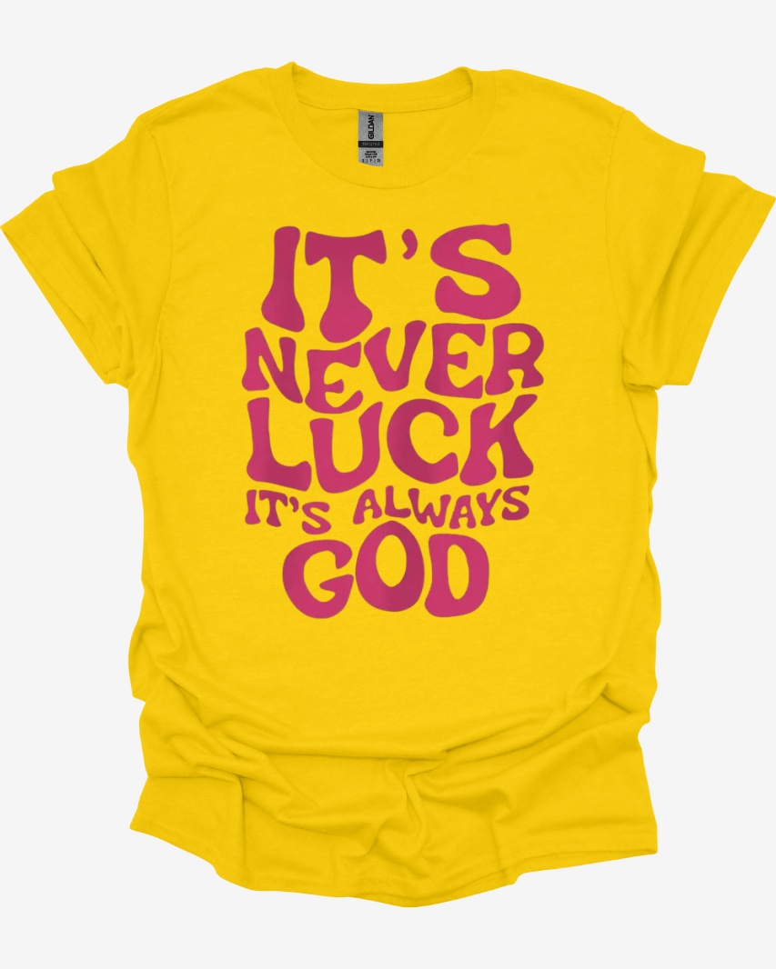 Yellow It’s Never Luck It’s Always God Faith Graphic Tee with pink text 'It's never luck, it's always God' on a white background